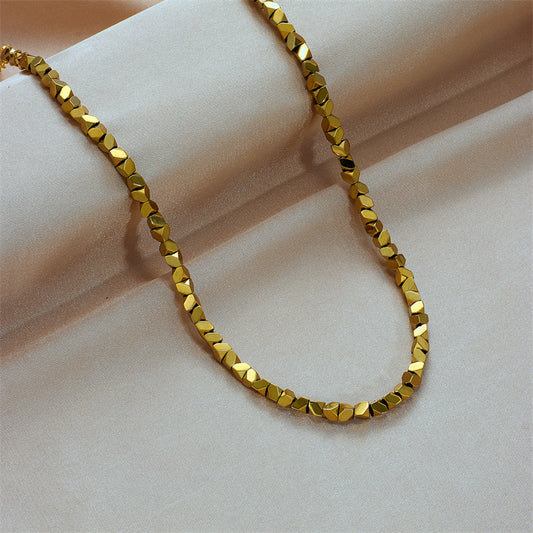 Gold Necklace with Geometric Beads