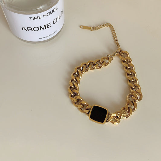 Chunky Gold Bracelet with Black Accent