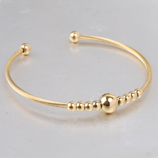 Open Gold Bracelet with Decorative Beads